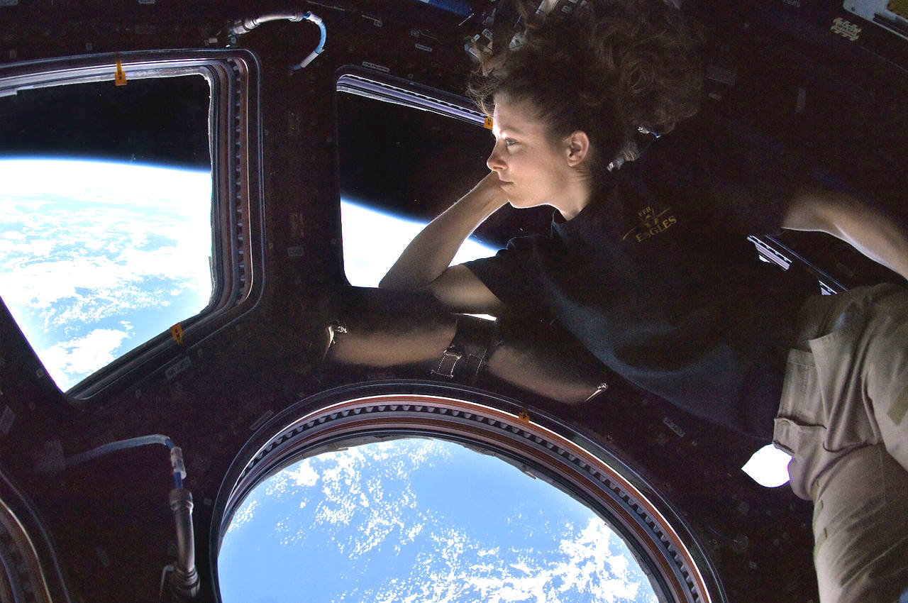 Tracy Dyson onboard the International Space Station, looking back at the blue planet earth we call home